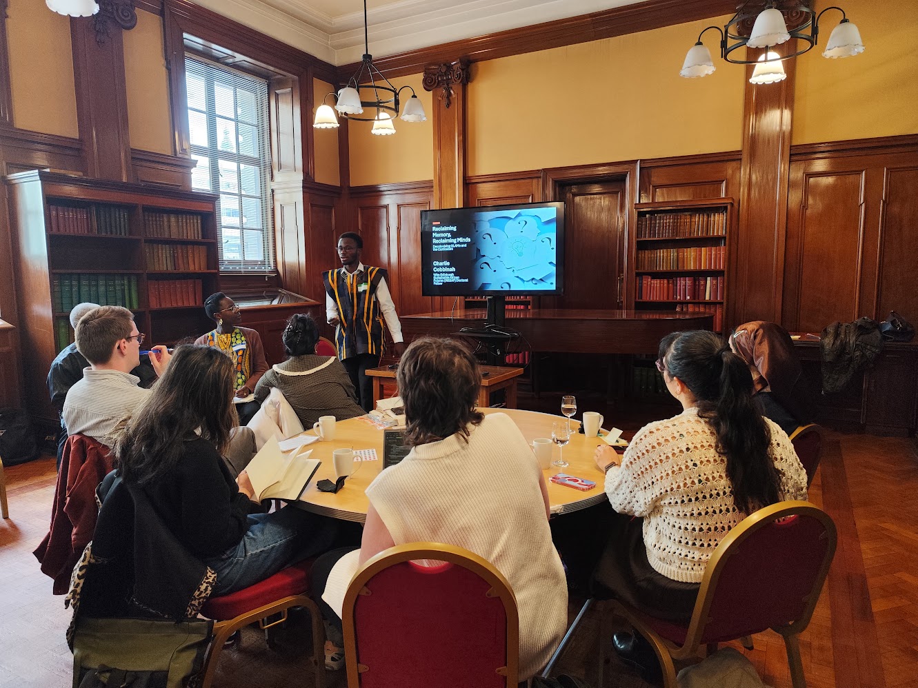 Charlie Cobbinah presenting at the DeCoGLAM event, University of Strathclyde